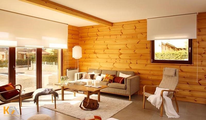 Bằng cách sử dụng gỗ tự nhiên để ốp phòng khách, không gian trở nên ấm áp và đầy cảm giác.