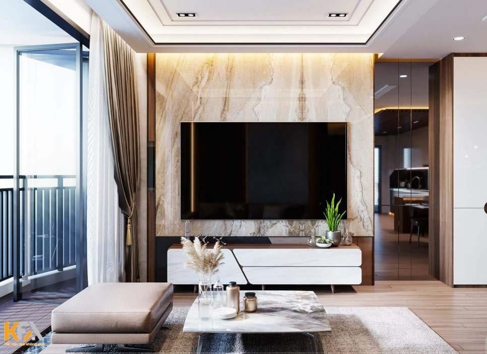 Chiếc vách tivi trong phòng khách chung cư được lên ý tưởng với chất liệu nhựa PVC giả đá, tạo nên một vẻ đẹp sang trọng và đồng thời tiết kiệm chi phí.